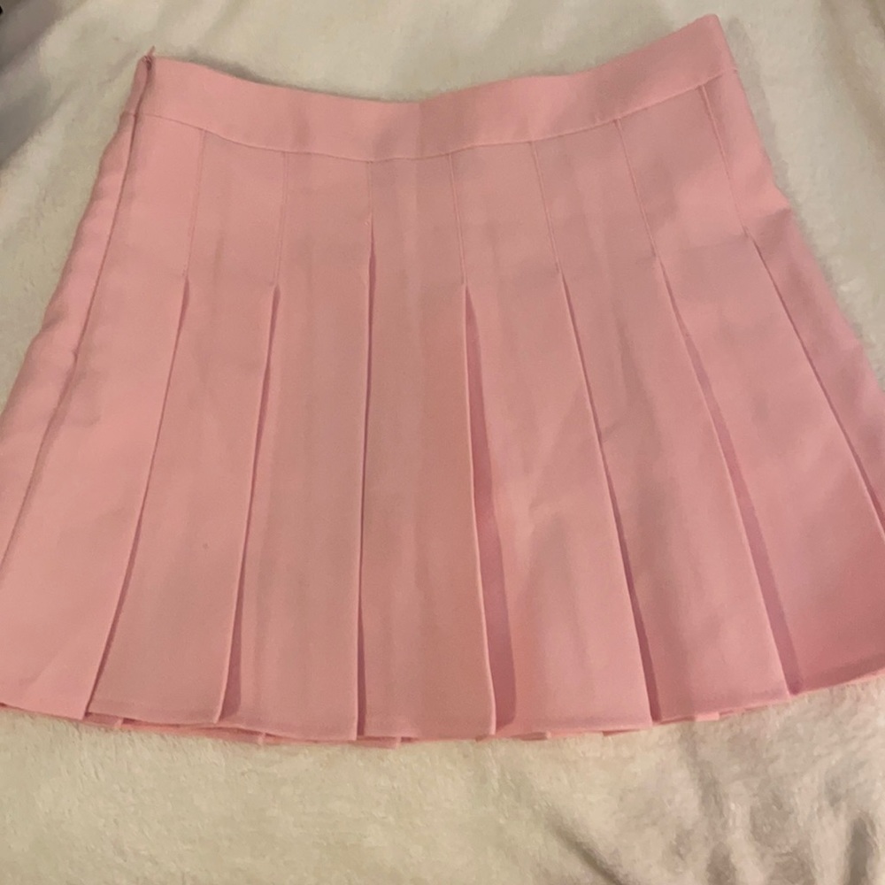 Pink pleated mini skirt